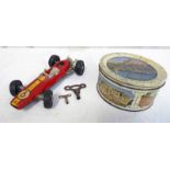 SCHUCO 1071 CLOCKWORK LOTUS FORMULA ONE CAR TOGETHER WITH A SELECTION OF GLASS MARBLES
