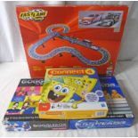 ELECTRIC SLOT RACING SET TOGETHER WITH THREE BOARD GAMES