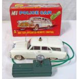 LOUIS MARX M1 BATTERY OPERATED POLICE CAR WITH REMOTE CONTROL.