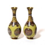 A pair of Japanese cloisonne enamel yellow ground vases and stands