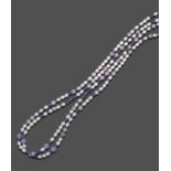 An Amethyst, Kunzite, Tanzanite, Coated Pyrite and Cultured Pearl Necklace, amethyst, blue