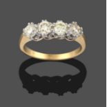 A Diamond Four Stone Ring, the round brilliant cut diamonds in white double claw settings, to a