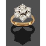 An 18 Carat Gold Diamond Cluster Ring, seven round brilliant cut diamonds in white claw settings, to