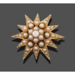 A Diamond and Split Pearl Star Brooch, an old cut diamond in a yellow claw and rubbed over setting