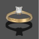 An 18 Carat Gold Diamond Solitaire Ring, the princess cut diamond in a white claw setting, to a