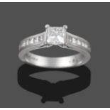An 18 Carat White Gold Diamond Solitaire Ring, the princess cut diamond in a claw setting, to