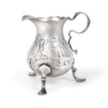 A George II Silver Cream-Jug, by Thomas Rush, London, Probably 1746, pear-shaped and on pad feet,