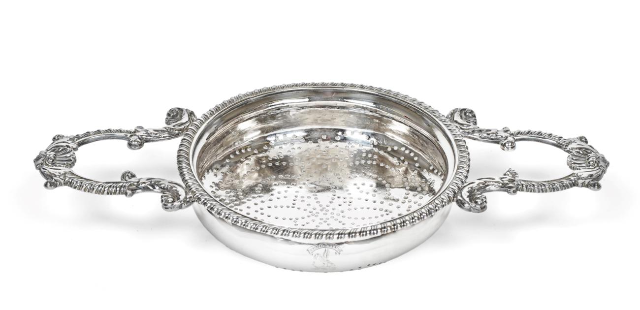 A George IV Silver Lemon-Strainer, by John Reily, London 1821, the bowl pierced circular and with