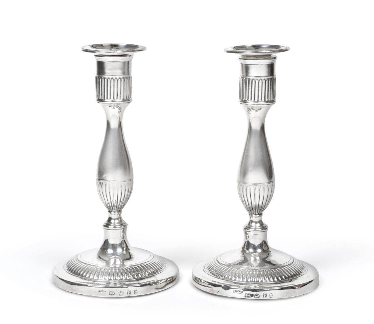 A Pair of George III Silver Candlesticks, by John Lindley and Co., Sheffield, 1799, each on circular