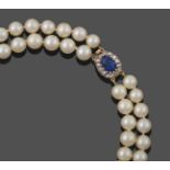 A Two Row Cultured Pearl Necklace, the 47:48 cultured pearls knotted to an oval clasp comprising