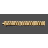 A Broad Fancy Link Bracelet, seven rows of lozenge shaped links, length 20cm see illustration .