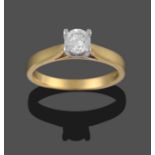 An 18 Carat Gold Diamond Solitaire Ring, a round brilliant cut diamond in a white claw setting, to a