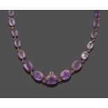 A 19th Century Amethyst Rivière Necklace, thirty graduated oval cut amethysts in yellow collet