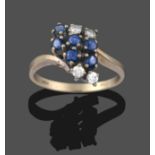 An Abstract 18 Carat White Gold Sapphire and Diamond Cluster Ring, twist shoulders terminating to