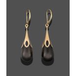 A Pair of 9 Carat Gold Jet Drop Earrings, a teardrop shaped jet bead suspended from a yellow five