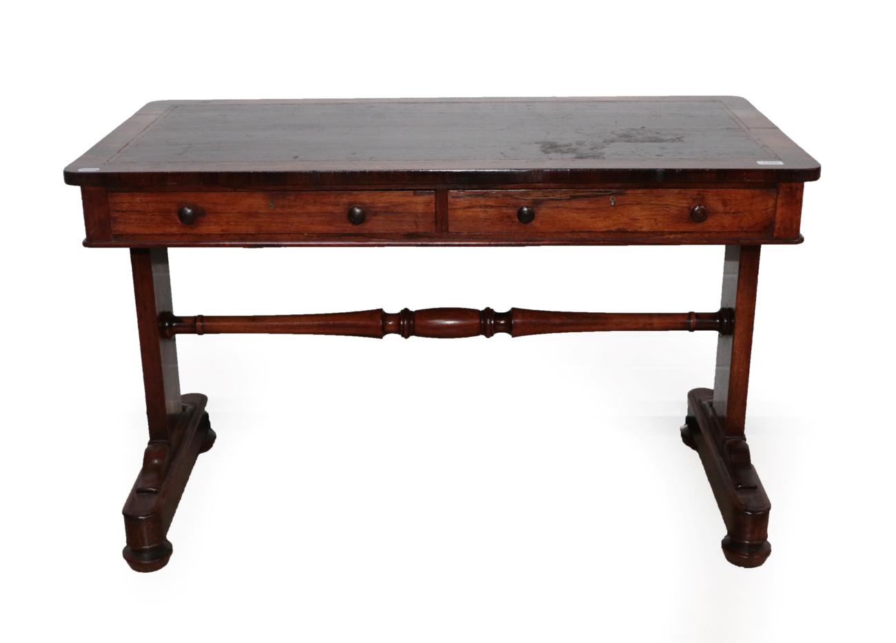 A Victorian Rosewood Pillar End Writing Table, mid 19th century, with a gilded red leather writing