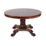 An Early Victorian Mahogany Circular Dining Table, circa 1840, with plain frieze, on a reeded