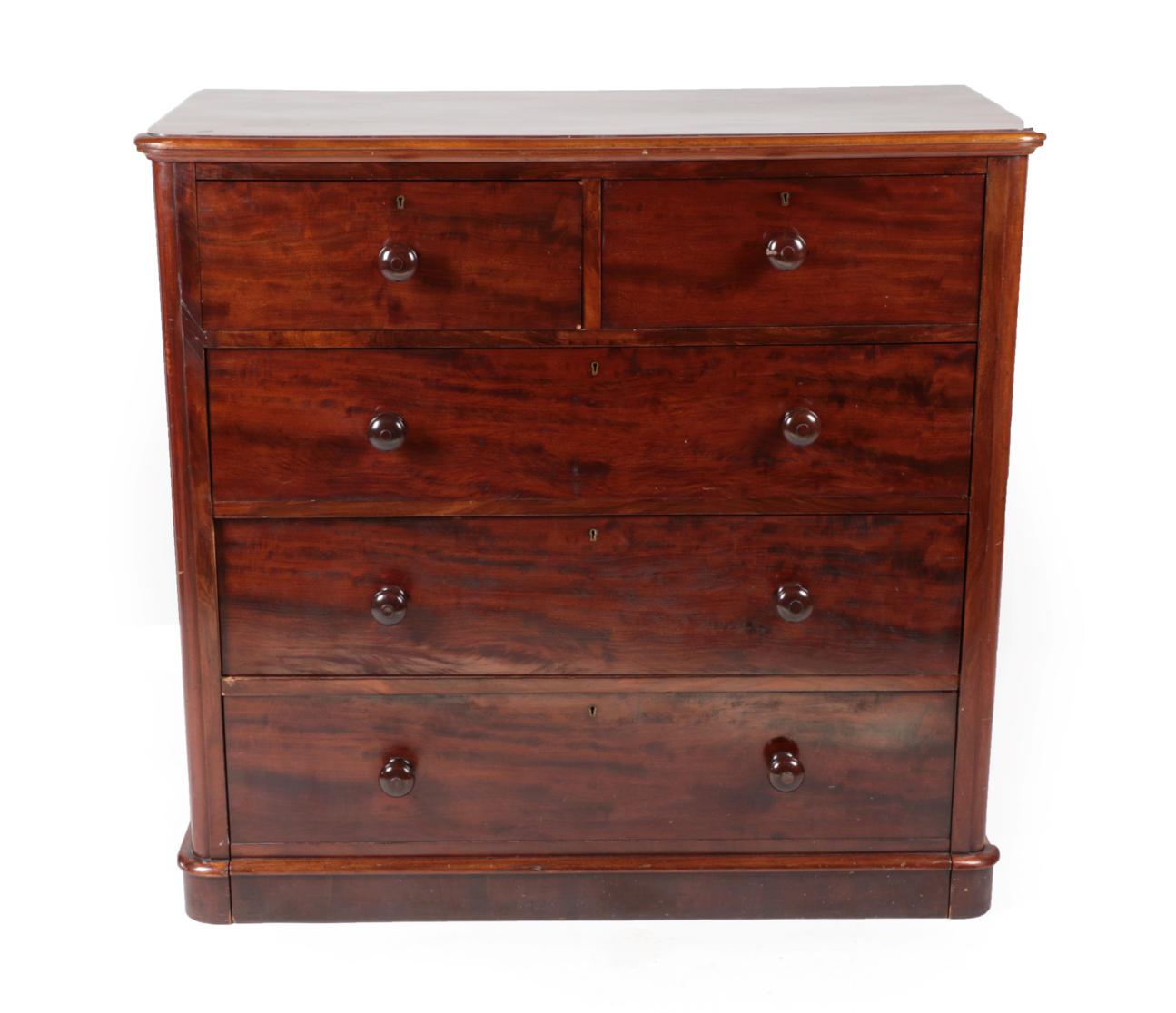 ^ A Victorian Mahogany Straight Front Chest of Drawers, circa 1870, with two short over three long
