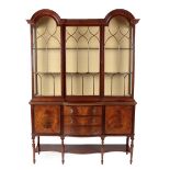 An Early 20th Century Mahogany Dome-Top Display Cabinet, the moulded top above a central lancet