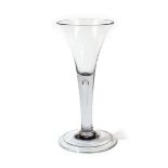 A Large Wine Glass, circa 1750, the trumpet bowl on a plain stem with air tear and folded foot, 19.