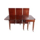 An Early 19th Century Mahogany Telescopic Extending Dining Table, with four original leaves, the