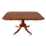 A Late George III Mahogany Tilt-Top Dining Table, early 19th century, of rounded rectangular form,