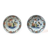 ^ A Pair of Lambeth Delft Dishes, circa 1760, painted in colours with a parrot perched amongst