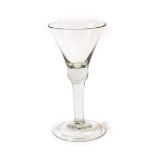 A Wine Glass, circa 1750, the trumpet bowl with basal knop, on a plain stem and folded foot, 16.