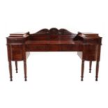 A Regency Mahogany Sideboard, in the manner of Gillows, early 19th century, with scrolled pediment