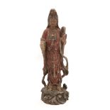 A Chinese Painted Wood and Gesso Figure of Guanyin, 19th century, standing wearing flowing robes,