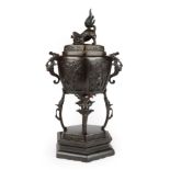 A Japanese Bronze Koro and Cover, Meiji period, of hexagonal form with mythical beast handles and