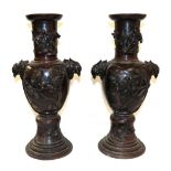 A Pair of Japanese Bronze Vases, Meiji period, of baluster form with trumpet necks and mask handles,