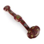 A Chinese Cloisonné Ruyi Sceptre, Qing Dynasty, worked with scrolling foliage on a claret ground,