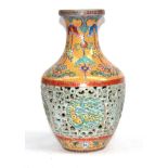 A Chinese Porcelain Reticulated Vase, Qianlong seal mark but not of the period, of baluster form,