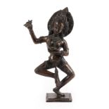 A Bronze Figure of a Dancing Dakini, Nepal, 19th century, standing on her left leg holding a blade