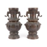 A Pair of Japanese Bronze Vases, Meiji period, of baluster form with elephant mask handles, cast