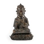 A Chinese Gilt Bronze Buddha, Ming Dynasty, probably 16th century, seated with scroll crown and a