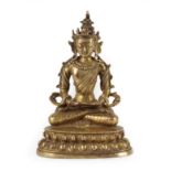 A Gilt Copper Alloy Figure of Amitayus, probably Tibetan, 18th century, seated cross-legged with