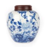 A Chinese Porcelain Ginger Jar, Kangxi, of ovoid form, painted in underglaze blue with a bird