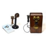 Wall Mounted Telephone with Bakelite ear piece, brass dial and external bells; together with a
