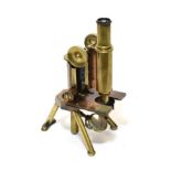 J Swift & Son (London) Brass Microscope with course/fine focussing, tripod base (mirror lacks planar