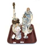 A Lladro figural table lamp, Lladro figure of a child, Lladro figure of a swan, Nao figure of a