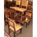 A Victorian mahogany rectangular breakfast table; together with six 19th century oak and leather