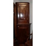 An early 19th century mahogany corner cabinet; together with a smaller oak example (2)