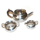 A three-piece Victorian silver tea-service, by Heath and Middleton, London, 1887 and 1888,