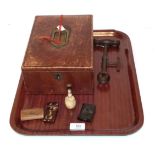A leather correspondence box; a 19th century corkscrew; a bone desk seal; a tortoiseshell manicure