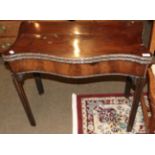 A George III mahogany serpentine fronted card table, with acanthus leaf spandrels and moulded