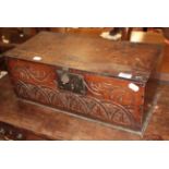A 17th century carved oak table box with hinged lid, 55cm wide