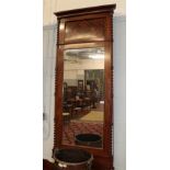 An Edwardian mahogany pier mirror with turned and fluted edges; together with a further Victorian