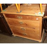 An early 20th century stripped pine chest of drawers, with an arrangement of four graduated drawers,